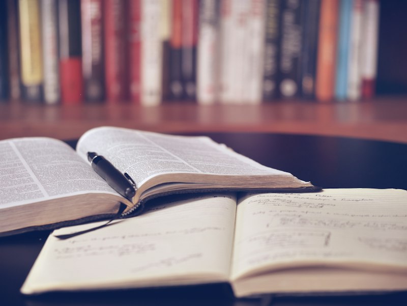Old books stacked on a table